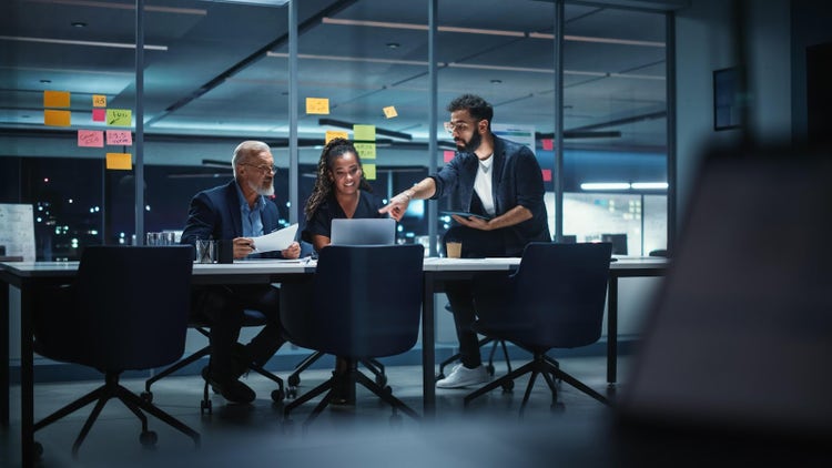 People discussing ideas around a table