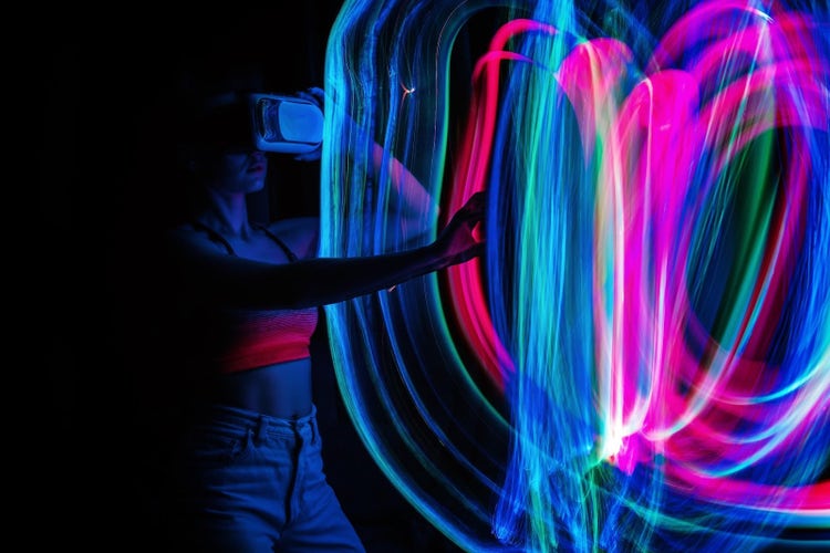 Woman with virtual goggles interacting with visualisation